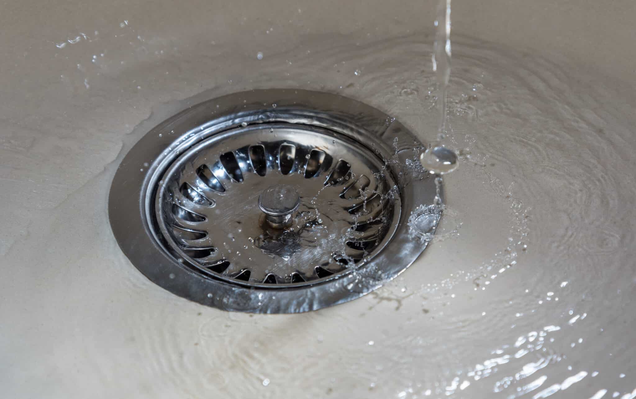 Water drains slowly from sinks, Sewer Backups.